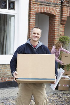 Removal van and moving team in a Notting Hill residential street