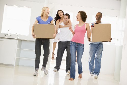 Removals team preparing items safely with protective coverings