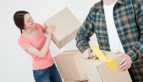 Moving van and packed boxes for a home move in Notting Hill