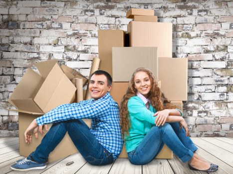 Crew using careful lifting techniques during a house move