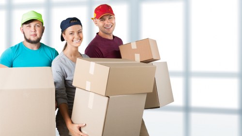 Removal van and moving crew in a Notting Hill residential street