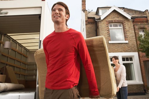 Local moving team handling boxes and furniture in Nottinghill