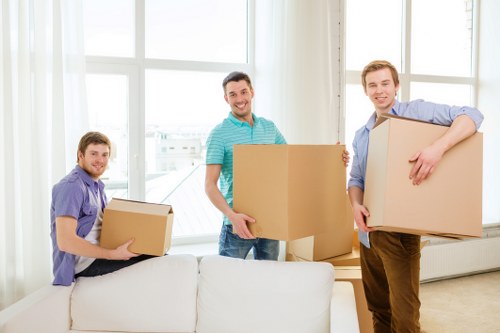 Packed office boxes and furniture ready for relocation in west London