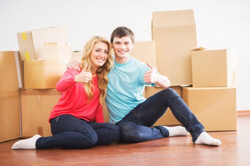 Removal team loading furniture for a move in West London
