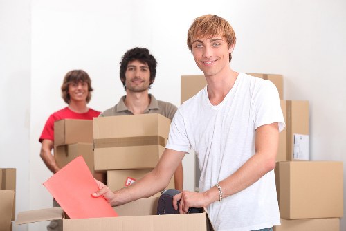 Team member reviewing safety procedures before lifting furniture
